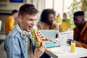 Student Holding Sandwich